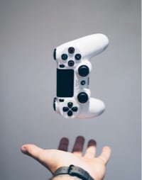 Gaming controler hovering over hand